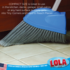 Lola angle broom sweeping leaves into blue dustpan outdoors; text: Indoor & Outdoor Use; inset shows bristles trapping debris on wet floor