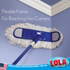 Flexible dust mop frame bending to reach into wall corner, cleaning floors and baseboards in tight spaces