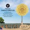 Large Tampico dish brush cleaning fresh produce under running water, vegetable scrub brush for kitchen use