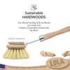 Pot and pan brush scrubbing a cast iron pan, kitchen cookware cleaning brush for pots and pans