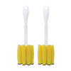 Two Lola glass jar brushes with white plastic handles, yellow foam sponge heads, and blue fiber scrubber tips shown side by side