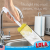 Hand using sponge puff bottle cleaner foam head in tall glass at kitchen sink; text: fits glasses and mugs, American family owned since 1969