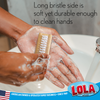 LOLA wood hand brush in use with soap to clean hands