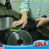 Hands scrubbing bottom of non-stick pan with green scourer side of Lola cellulose sponge; American owned & operated since 1969