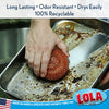 Lola Jumbo Copper Mesh Scourer removing baked-on food residue from a metal pan