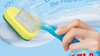 Hand holding blue Sudser wand with yellow-green sponge head in soapy water suds for kitchen cleaning