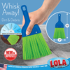 Handheld whisk broom with firm bristles sweeping dirt and debris from concrete, 10 x 5 inches