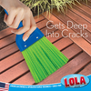 Whisk broom gets deep into cracks, sweeping between deck planks on red-brown hardwood outdoor deck