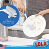 Lola Pro Utility Dish Brush infographic with built-in stiff brush tip close-up callout; person scrubbing dirty plate at sink