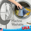 Machine washable blue microfiber cloth being placed by hand into a front-loading washing machine drum