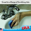 Lola blue sponge cleaning a white bathroom sink basin under running water, great for a range of scrubbing jobs