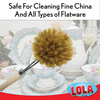 Lola long-handled Tampico bottle brush cleaning a blue and white china teacup, safe for fine china and flatware