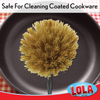 Top-down view of the Lola natural Tampico bottle brush cleaning a nonstick pan with soft Tampico bristles